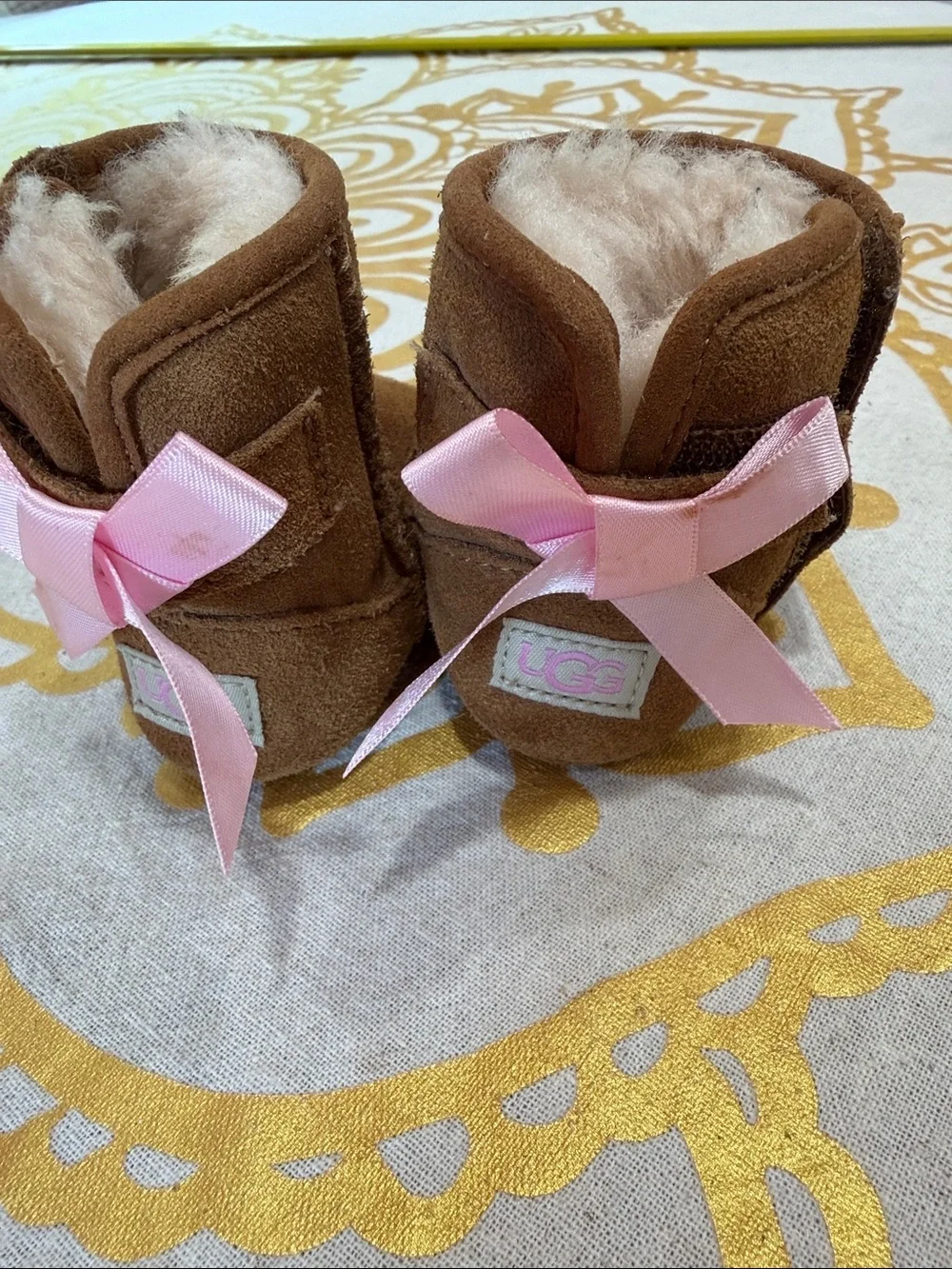 UGG Kids Brown Shearling Boots with Pink Ribbon